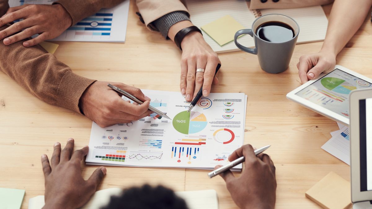 Two people reviewing a project plan together